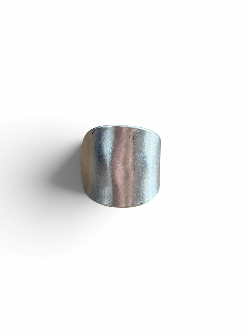 Smitsjewellery silver statement ring with a polished, elongated architectural silhouette and smooth surface.