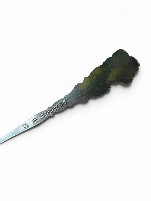 Smitsjewellery ornate silverplated spoon with floral motif and "SILVERPLATED" stamp.